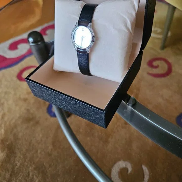 Exquisite, RARE Movado Allia, mirror face with .45 carat diamonds